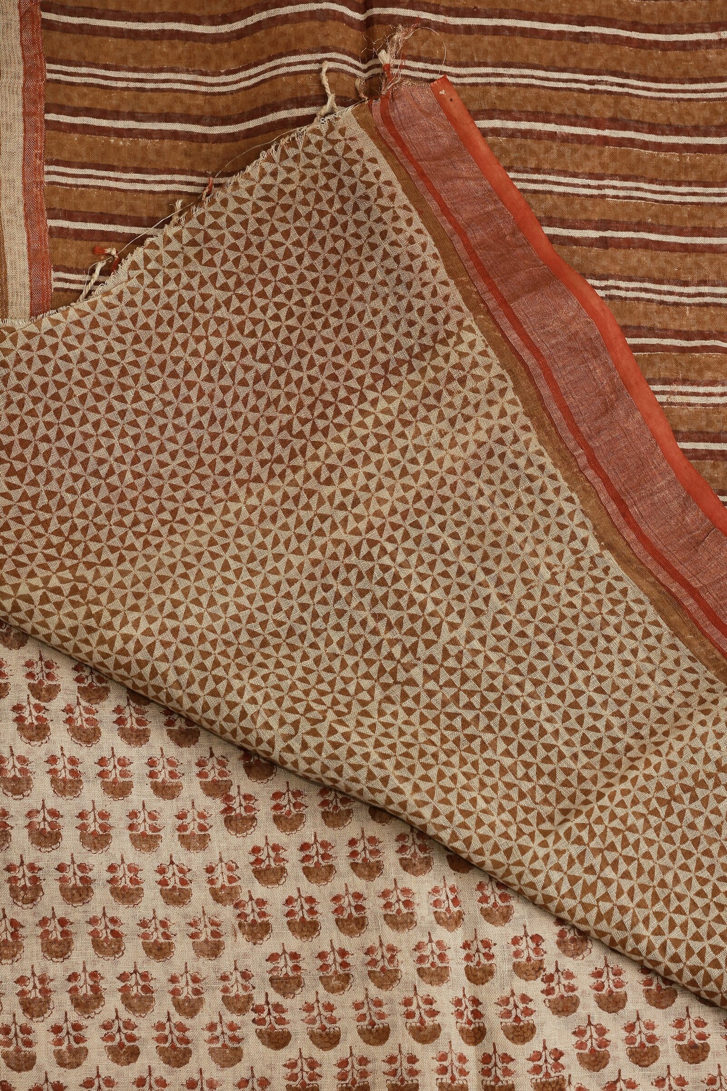 Bagru Linen Saree With Brick Red Golden Zari Border, folded saree view