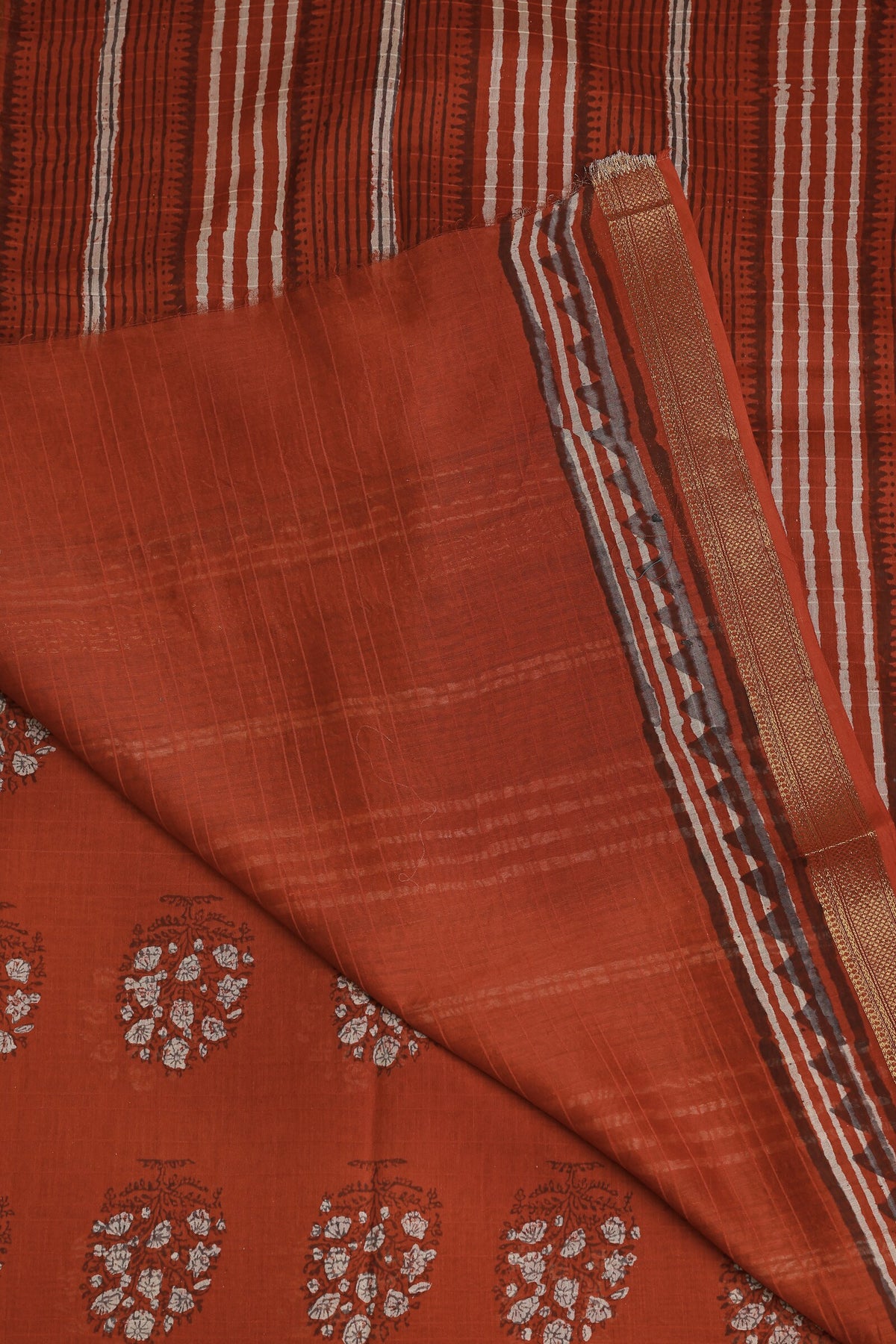 Brick Red Chanderi Silk Saree With Handblock Print, folded saree view