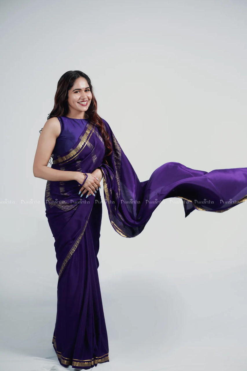 Woman moving freely in a purple Mysore silk saree