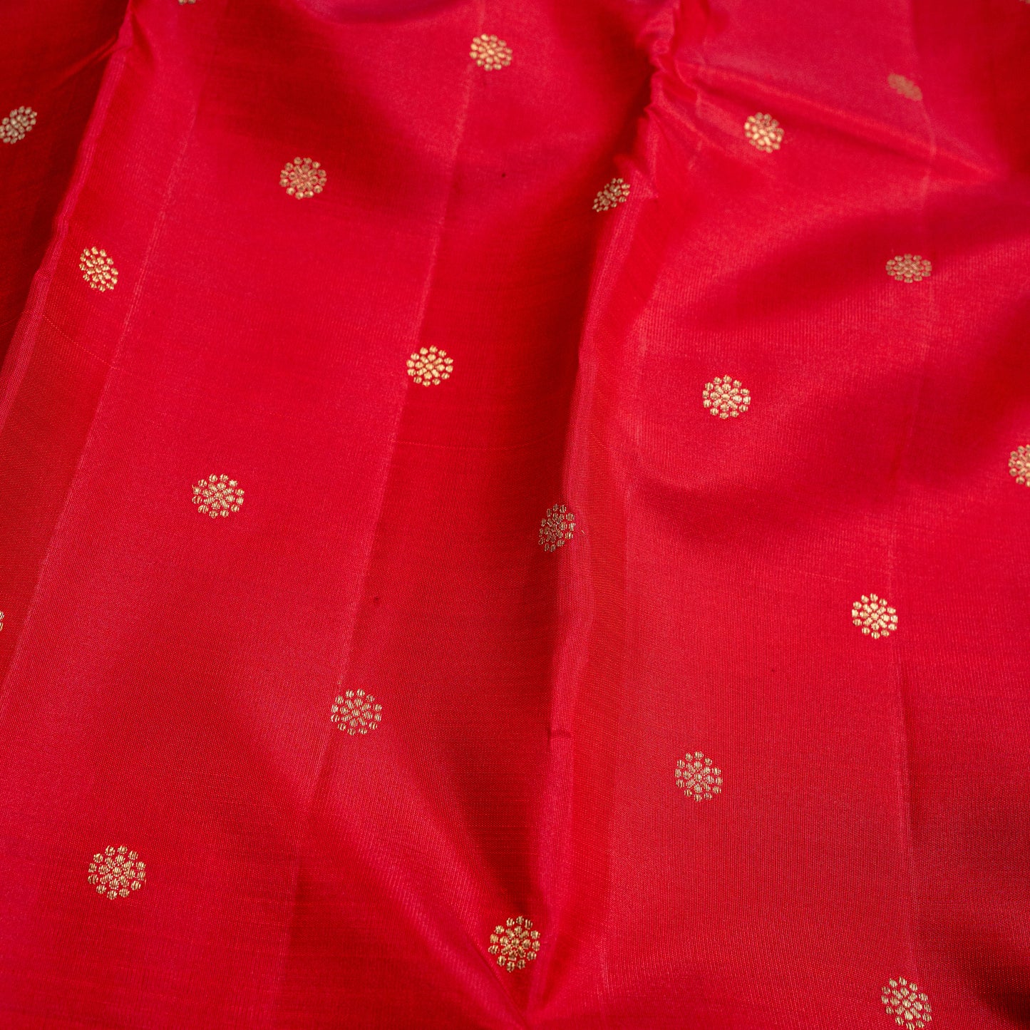 A red handwoven Kanchipuram silk saree in pure silk with 3-gram gold zari,