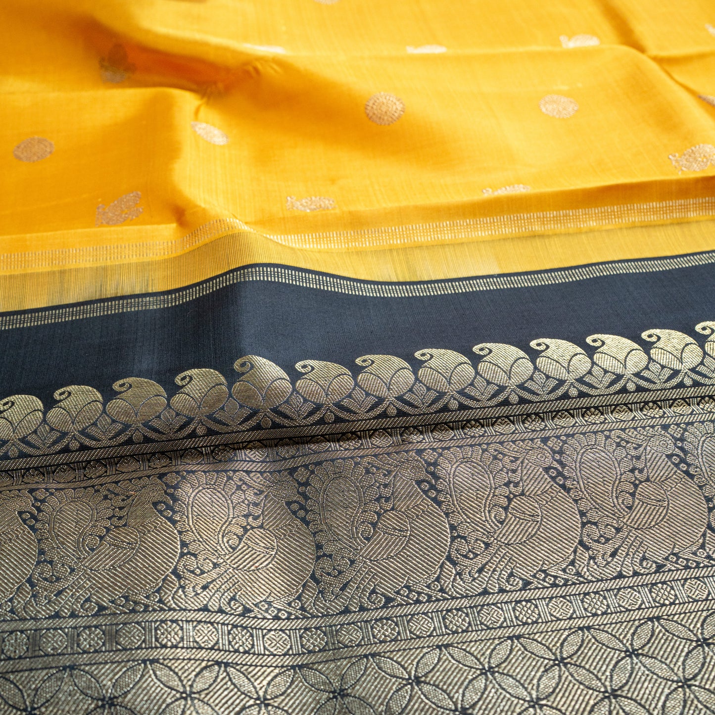 Radiant yellow Handwoven Kanchipuram 3-gram gold zari silk saree with Black pallu