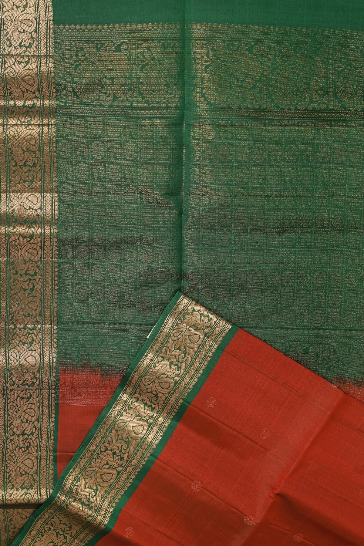 Brick Red And Green Pure Silk Saree With Peacock Zari Border, folded saree view