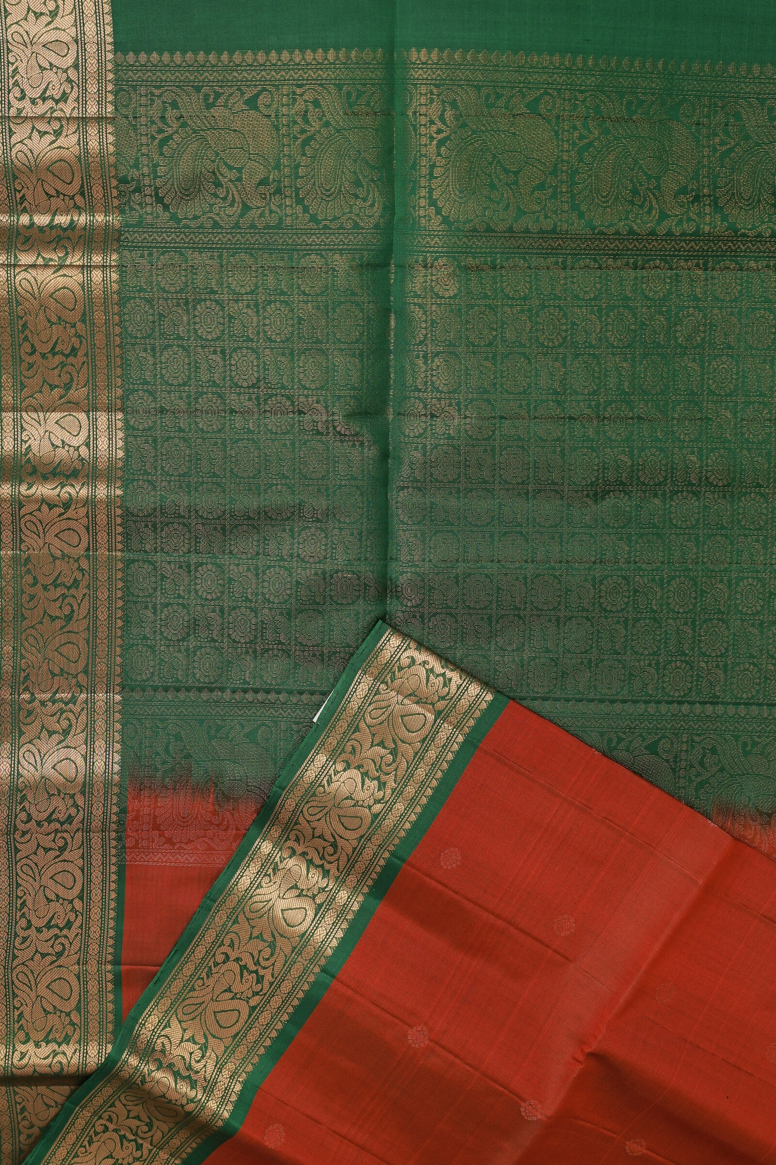 Brick Red And Green Pure Silk Saree With Peacock Zari Border, folded saree view