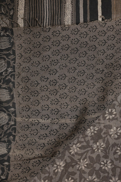 Dark Grey Linen Handblock Print Saree With Black And Zari Border, folded saree view