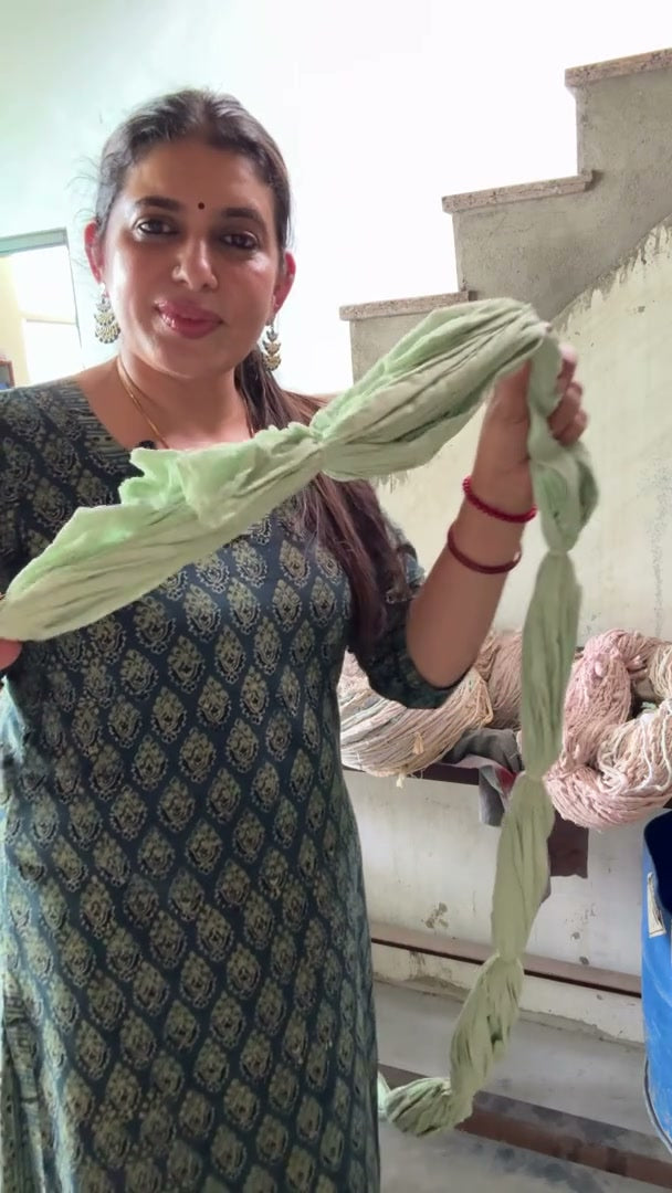 Rekha showing tied fabric before dyeing