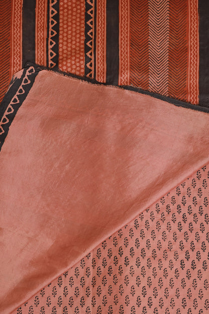 Soft Salmon Pink And Black Handblock Print Saree With Natural Dye, folded saree view