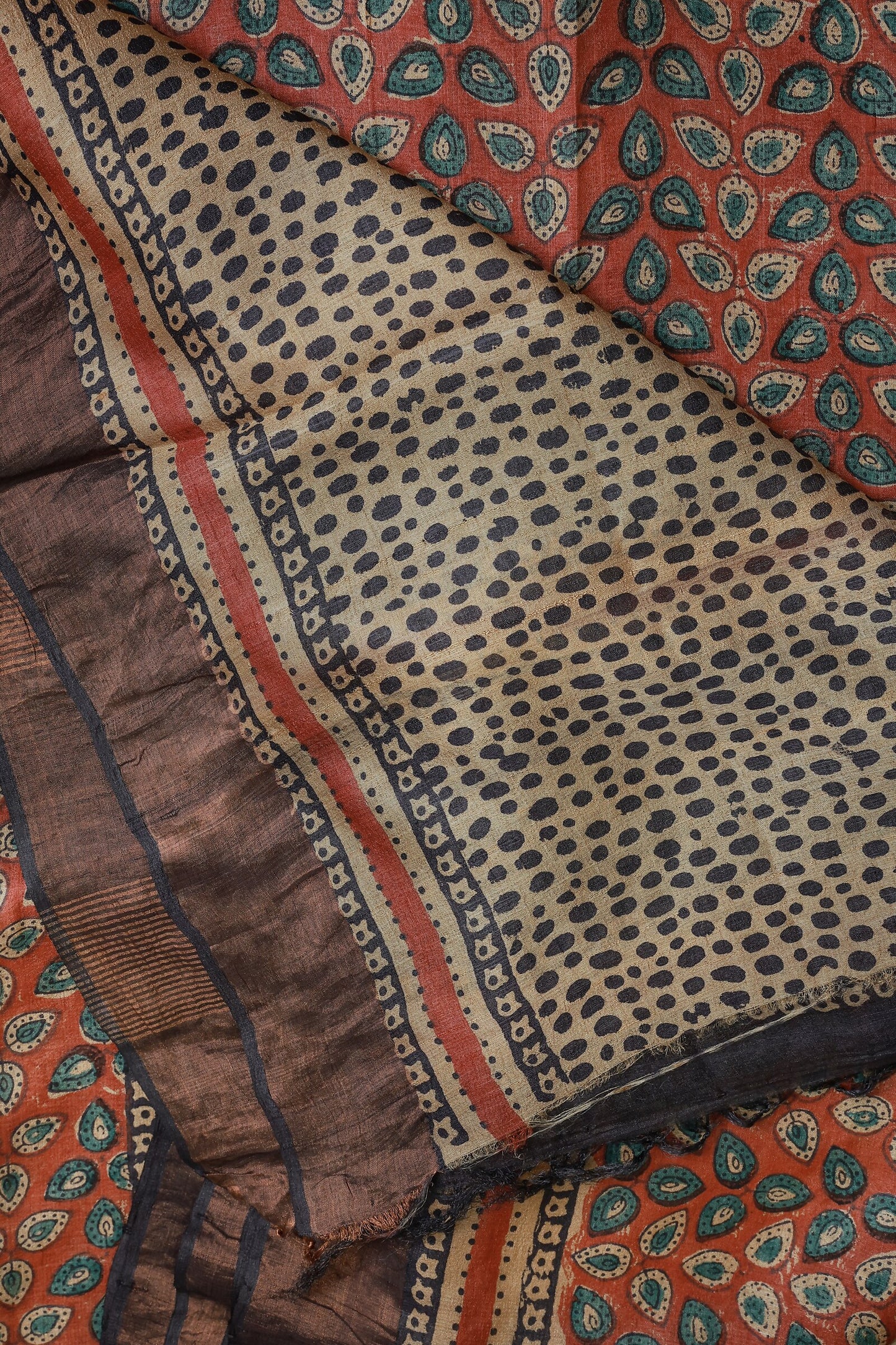 Terracotta Red Tussar Silk Saree With Natural Dye And Handblock, folded saree view