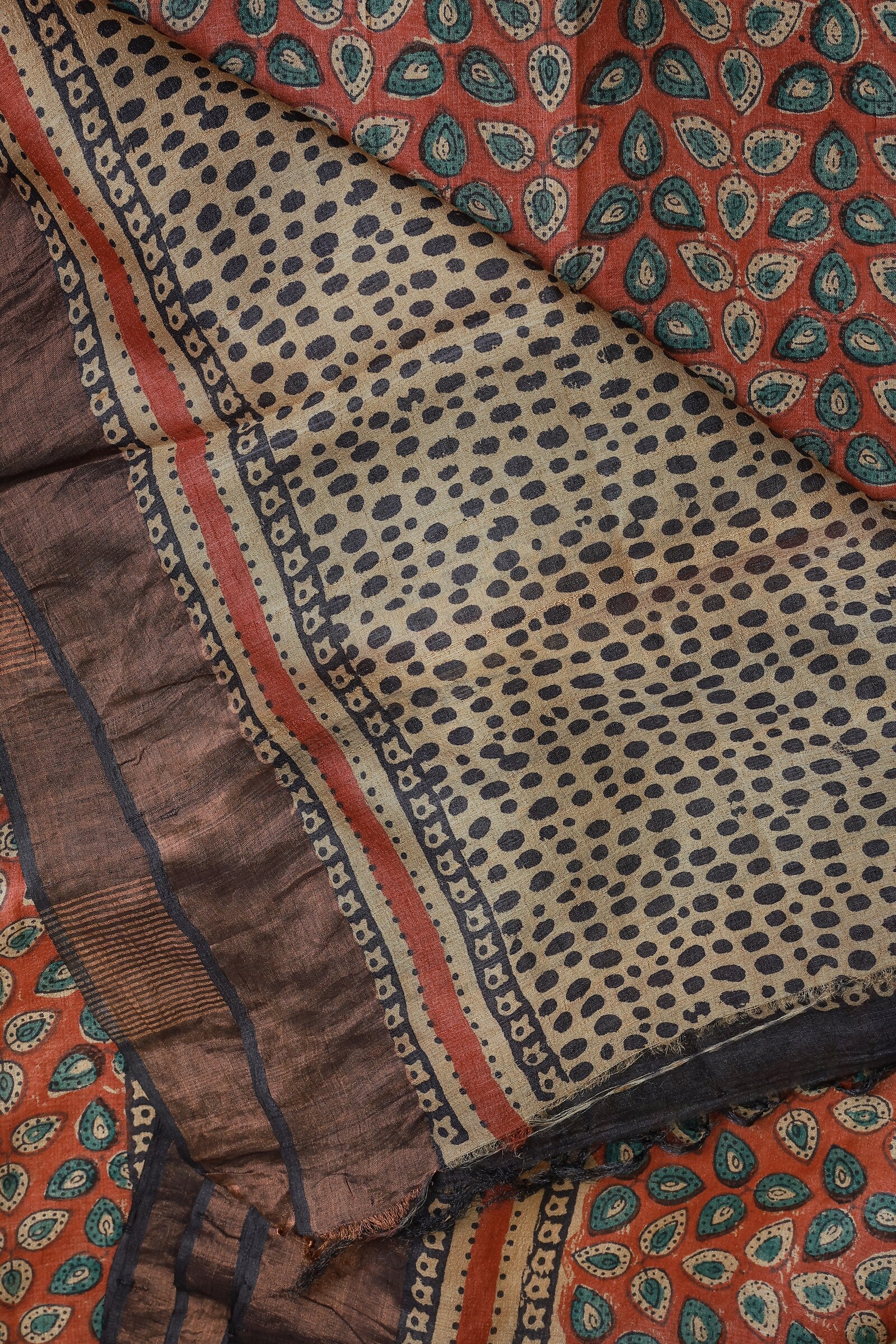 Terracotta Red Tussar Silk Saree With Natural Dye And Handblock, folded saree view