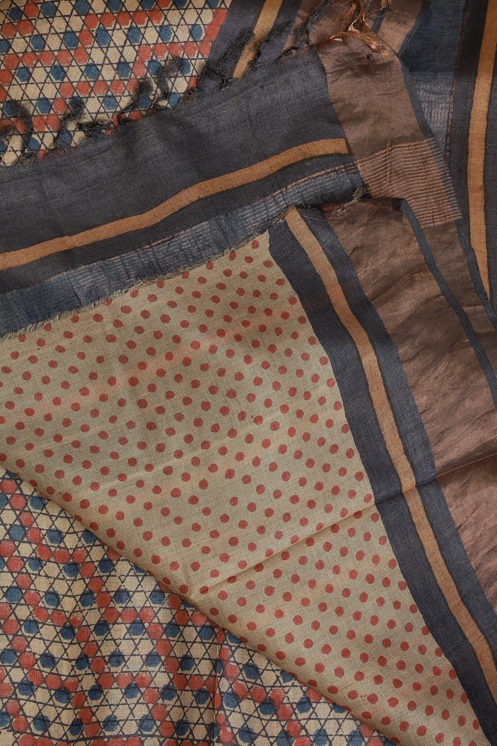 Tussar Silk Handblock Print Saree With Golden Zari Border, Red And Blue Triangle Polka Dots, And Natural Dye, folded saree view